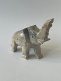 Elephant stone sculpture on a white background