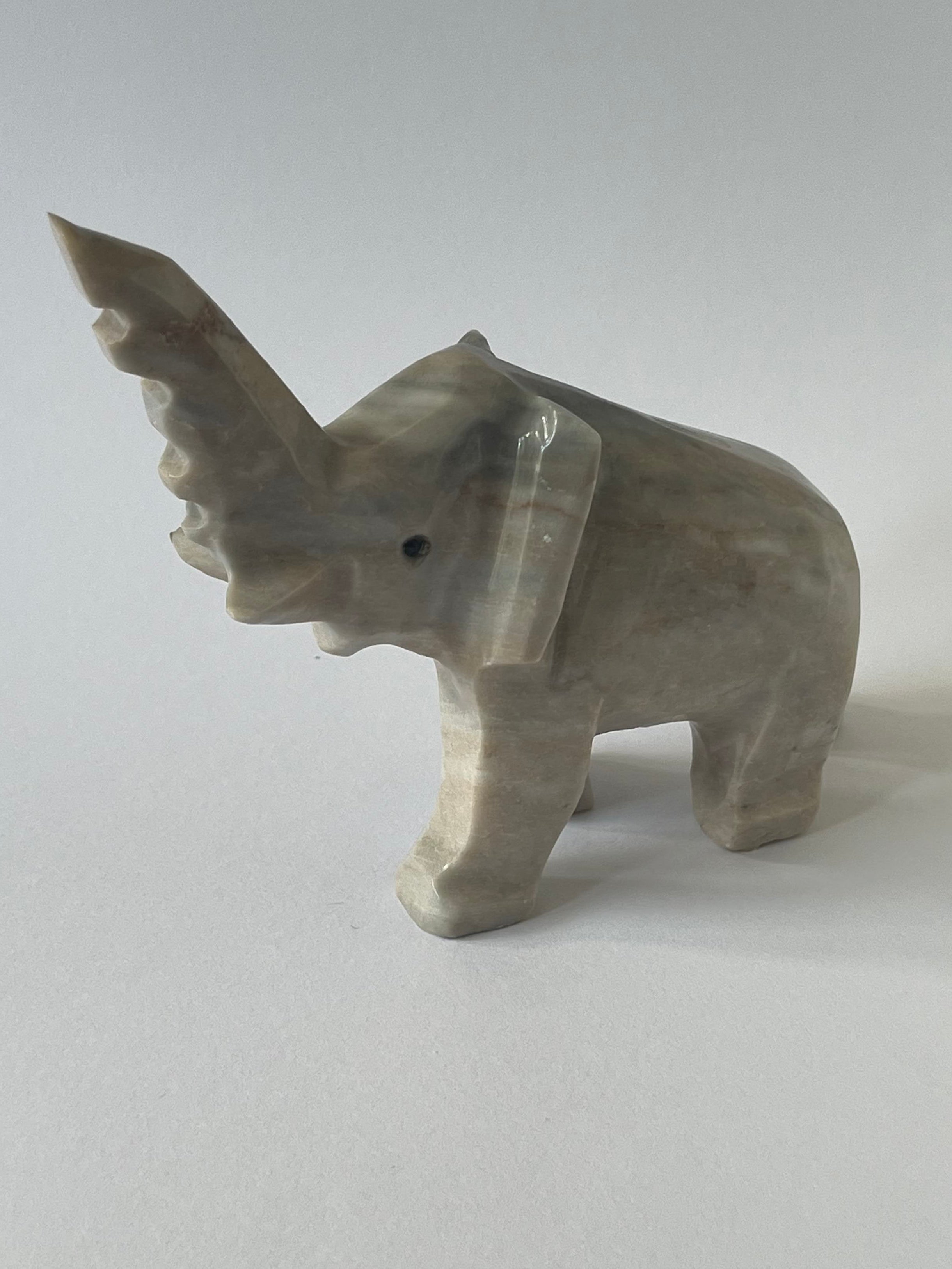 Gray Elephant Sculpture on a white background